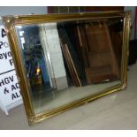 A large gilt framed mirror