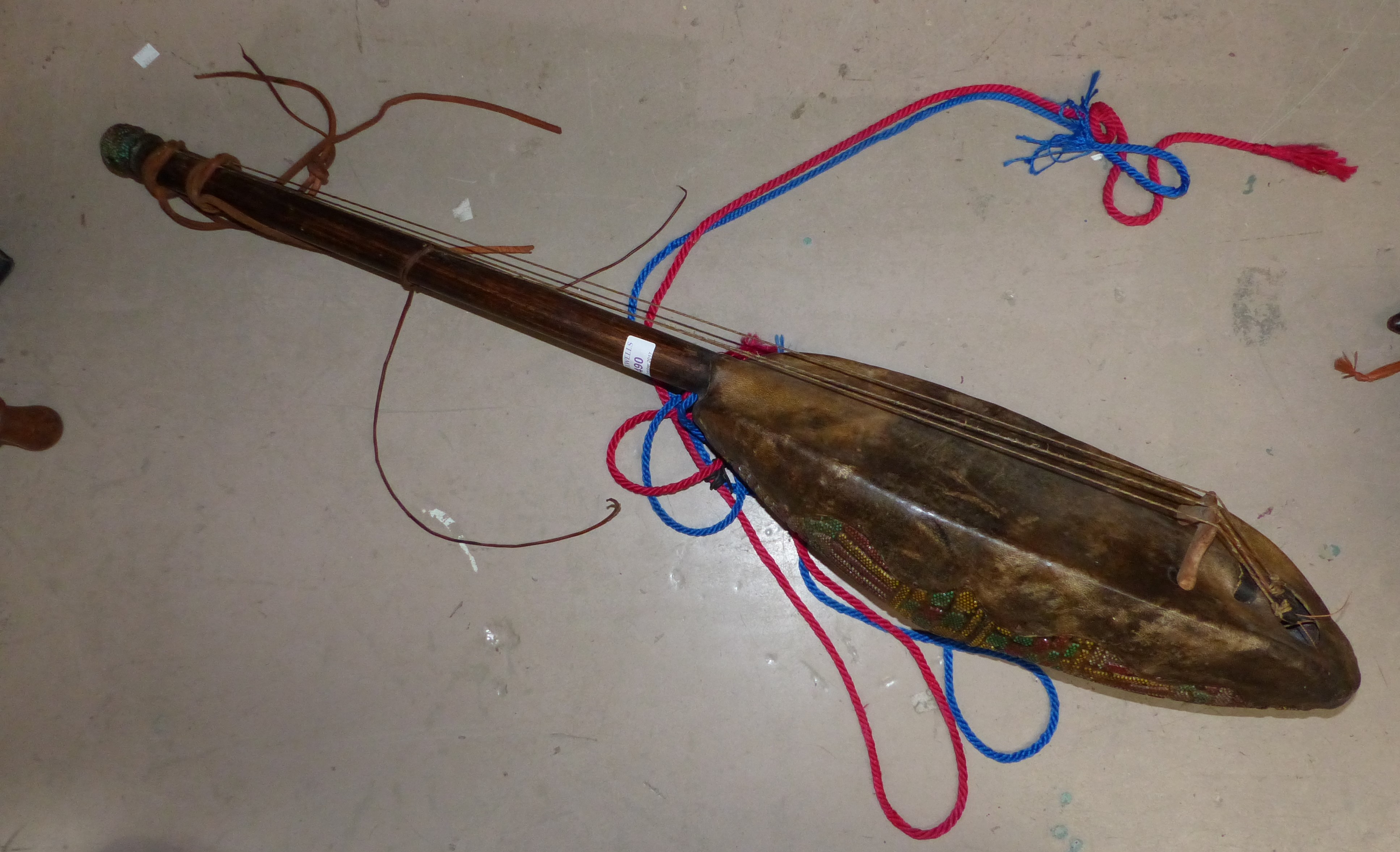 An unusual musical instrument with 3 strings and beaded decoration to the body and vellum cover - Image 2 of 2