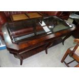 An Ethan Allen large flame figured mahogany coffee table, 2 tiers, on 6 legs, with glass top, 54"