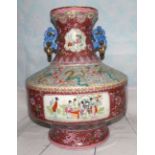 A Chinese porcelain famille rose urn with genre scene panels and ornate bands of dragon and floral