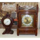 An Edwardian oak architectural mantel clock with brass dial and ting tang movement