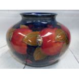 A Moorcroft Pomegranate pattern vase of compressed spherical form, height 4½"