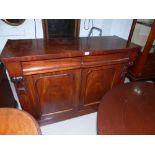 A Victorian mahogany chiffonier with arched carved back, 2 drawers and 2 panelled cupboard doors