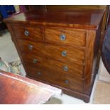 An early 19th century mahogany chest of 3 long and 2 short drawers, with line inlay and brass ring