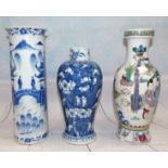 A Chinese cylindrical vase decorated in underglaze blue, with pagodas, etc., height 10½" (chips to