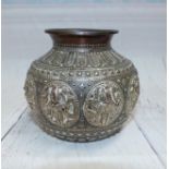An Indian silver on copper spherical vase with panels of Hindu deities, diameter 4½"