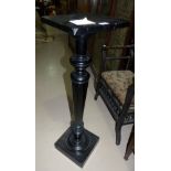 A Victorian ebonized torchere