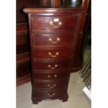 A stained mahogany narrow 7 height chest of drawers