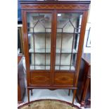 An Edwardian inlaid mahogany china cabinet with 2 glazed doors and square top legs
