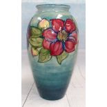 A Moorcroft large baluster vase decorated with clematis against a light blue ground, impressed,