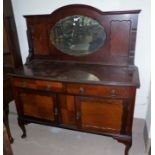 A 1920's quarter veneered mahogany mirror back sideboard of 2 cupboards and 2 drawers