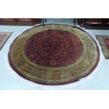 A modern middle eastern hand knotted circular rug, 71" diameter
