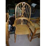 A country made light elm rocking chair with 'H' stretcher