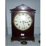 A 19th century mahogany cased mantel clock, applied ebony banding, ball feet, 17¾"