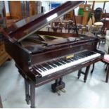 A mahogany cased iron framed baby grand piano by Kessels, on twin square tapering legs, with stool