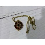 A garnet pendant on chain, stamped '9CT', 5.6 gm