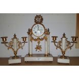 A late 19th century Louis XVI style clock garniture, white marble with extensive ormolu mounts,