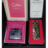 A 1960's engine turned Calibri Monopol lighter, in original box; a Kingsway Avenger gas lighter