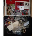 A cream leather effect jewellery box and costume jewellery