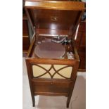 An HMV windup gramophone in oak floor standing case