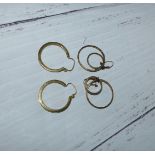 A pair of 9 carat hallmarked gold gypsy style earrings; a similar double ring pair, stamped '375',