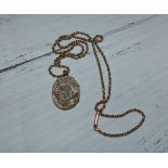 An unmarked locket on chain stamped '9C', chain 5.3 gm