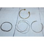 Three silver interlocking bangles, import marks; 4 other bangles