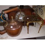 An Edwardian inlaid oak architectural mantel clock with chime; a copper kettle; a brass trivet; a