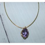 A 9 carat gold neck chain with pendant drop set purple stone