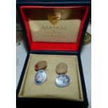 A pair of silver cufflinks by Aspinal, with engraved crest, in original box