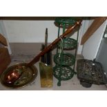 A 4 tier cast metal stand; a copper warming pan; an embossed magazine rack and similar mirror; a