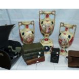 A garniture of Royal Vienna pottery vases; 2 cameras; various books