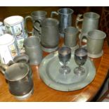 A selection of pewter mugs etc