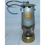 A miners' lamp by The Protector Lamp & Lighting Co Ltd