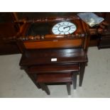 A nest of 3 oak occasional tables; a reproduction wall clock