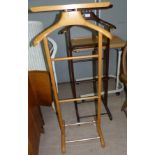 Two valet stands; a bed table; 2 white bedroom chairs