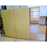 A modern lightwood effect bedroom suite comprising 2 double door wardrobes; 2 side cabinets; 2