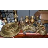 A large selection of brass and pewter teaware