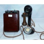 A vintage stick telephone with box