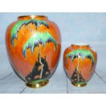 A 1930's Carlton baluster vase, orange lustre decorated with trees in a landscape, height 8½"; a