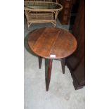 A country lamp table with round top on tripod support. 17'' diameter