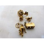 8 miscellaneous 9ct charms. 24.4g