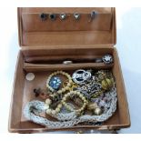 A leather case of miscellaneous costume jewellery