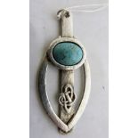 An Arts and Crafts silver pendant with Celtic knot design and set with a Ruskin cabochon. 3'' high