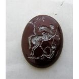 An oval hardstone intaglio, with silvered matrix of a figure on horseback. 1½'' high