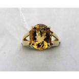 A citrine solitaire ring. In gold marked 375. Size M