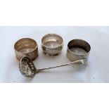 A Georgian silver sifter spoon by Peter and Ann Bateman and three silver napkin rings. 1oz 18 dwts