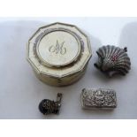 A Siamese silver repousse decorated pill box, a white metal clam shell purse, a filigree scent