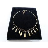 A 9ct fringe necklace. 9.4g