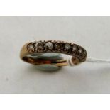 A nine white stone ring. In gold marked 375. 2.4g gross